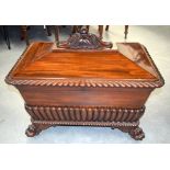 A FINE EARLY 19TH CENTURY MAHOGANY WINE COOLER C1810 possibly Irish, with well carved finial and paw