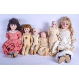 SIX ANTIQUE CONTINENTAL PORCELAIN BISQUE HEADED DOLLS including Armand Marseille. Largest 70 cm long