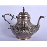 AN ANTIQUE CONTINENTAL SILVER TEAPOT decorated with foliage and vines. 442 grams. 17 cm x 13 cm.