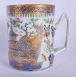 AN 18TH CENTURY CHINESE EXPORT BLUE AND WHITE MUG Qianlong, painted with landscapes. 11 cm high.