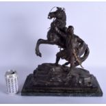 A LARGE 19TH CENTURY FRENCH SPELTER FIGURE OF A STANDING MALE modelled beside a rearing horse. 43 cm