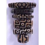 SIX CHINESE TIBETAN AGATE ZHU BEADS 20th Century. Largest 7 cm long. (6)