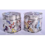 A LOVELY PAIR OF CHINESE SILVER AND ENAMEL TRINKET BOXES AND COVERS decorated with foliage. 300 gram
