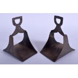 A PAIR OF 19TH CENTURY SILVER INLAID IRON STIRRUPS decorated with foliage. 16 cm x 11 cm.