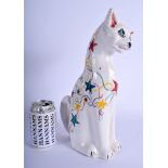 A LARGE BRANNAM FIGURE OF A CAT painted with stars. 34 cm x 16 cm.