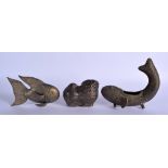 A 19TH CENTURY INDIAN HINDU BRASS FISH together with two others. Largest 19 cm wide. (3)