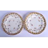 Royal Crown Derby fine pair of plates painted with floral swags and scattered spray of flowers under