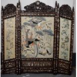 A LATE 19TH CENTURY CHINESE SILK WORK EMBROIDERED SCREEN Late Qing, within a hongmu frame, decorated