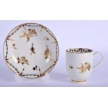 18th c. Caughley coffee cup and saucer decorated with blue and gilt flowers and swags, S mark