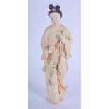 AN EARLY 20TH CENTURY CHINESE PAINTED IVORY FIGURE OF A FEMALE Late Qing. 15 cm high.