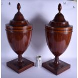 A LARGE PAIR OF EDWARDIAN MAHOGANY AND SATINWOOD KNIFE BOXES Adams style, upon square form bases. 60
