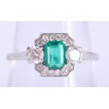 A FINE ART DECO PLATINUM EMERALD AND DIAMOND RING. 3.5 grams. O/P.