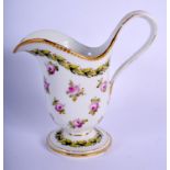 19th c. Paris porcelain footed milk jug painted with roses under a leaf and berry chain and dentil g