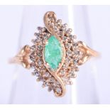 A 14CT GOLD DIAMOND AND EMERALD RING. 4.3 grams. N.