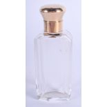 AN ANTIQUE 18CT GOLD MOUNTED GLASS SCENT BOTTLE. 9.5 cm high.