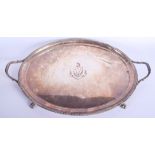 AN ANTIQUE OLD SHEFFIELD PLATED TWIN HANDLED TRAY with central armorial. 50 cm x 32 cm.