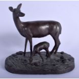 AN EARLY 20TH CENTURY FRENCH BRONZE FIGURE OF TWO DEER modelled drinking from a steam. 18 cm x 17 cm