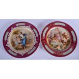 A PAIR OF EARLY 20TH CENTURY VIENNA PORCELAIN PLATES painted with classical scenes. 23 cm diameter.