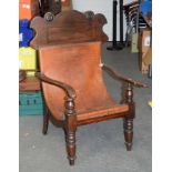 A 19TH CENTURY COLONIAL LEATHER BACK PLANTATION CHAIR with shaped arms and bead work mounts. 106 cm