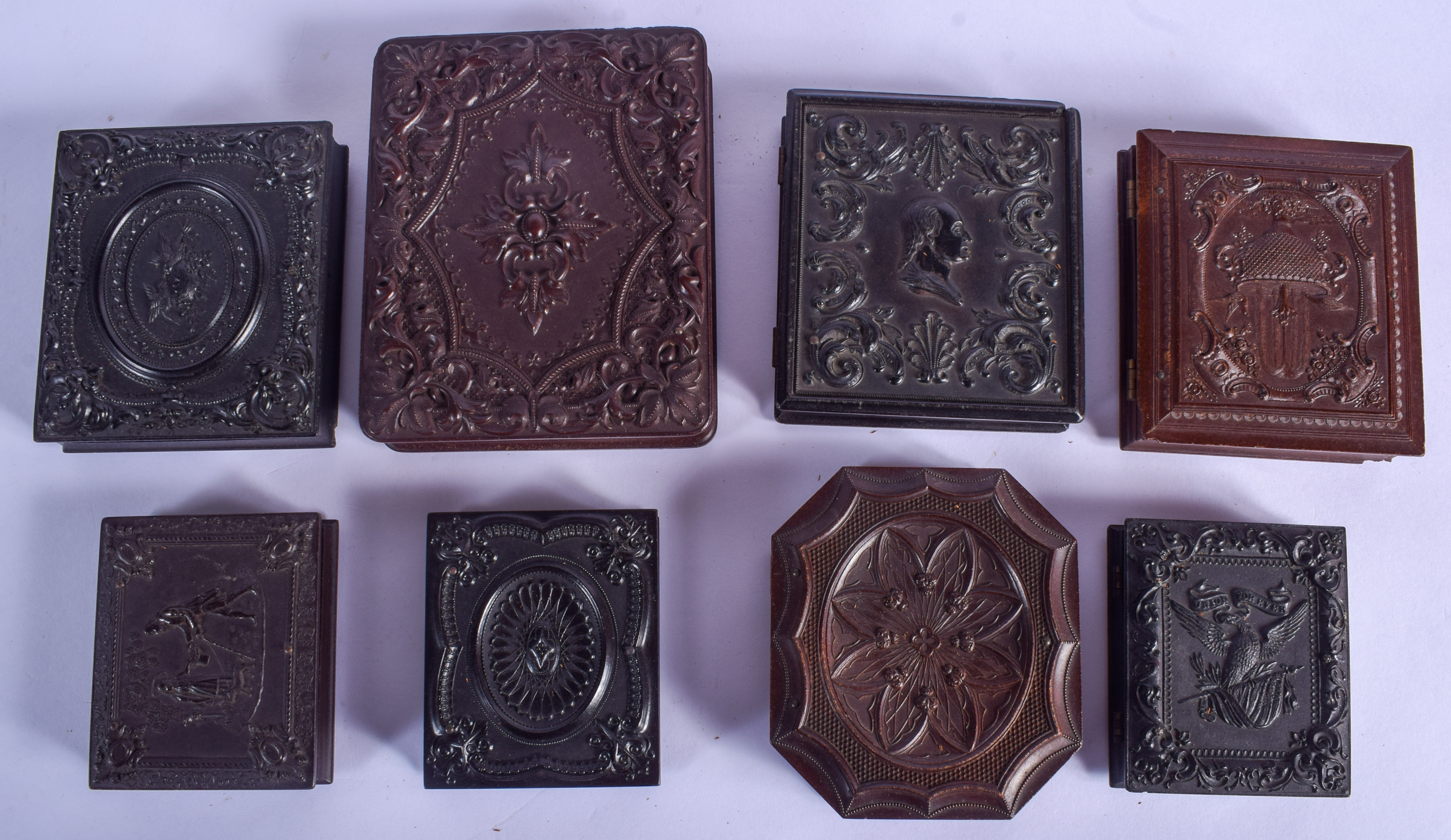 EIGHT ANTIQUE DAGUERREOTYPES in various forms and sizes. Largest 14 cm x 10 cm. (8)