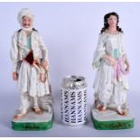 A LARGE PAIR OF 19TH CENTURY FRENCH JACOB PETIT PORCELAIN SCENT BOTTLES formed as an Eastern male an