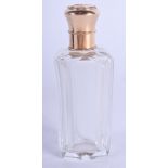AN ANTIQUE 18CT GOLD MOUNTED GLASS SCENT BOTTLE. 9.5 cm high.