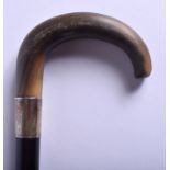 A 19TH CENTURY CONTINENTAL CARVED RHINOCEROS HORN WALKING CANE with ebony shaft. 94 cm long.