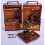 AN UNUSUAL 19TH CENTURY ENGLISH BRASS MICROSCOPE TYPE INSTRUMENT within a box with vacant compartmen