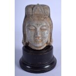 AN EARLY 20TH CENTURY CHINESE CARVED STONE HEAD OF A BUDDHISTIC DEITY Late Qing/Republic. Stone 11 c