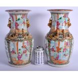 A LARGE PAIR OF 19TH CENTURY CHINESE CANTON FAMILLE ROSE VASES Qing, painted with figures and landsc