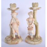 Royal Worcester good Hadley pair of candle stick figures of a boy and girl date code for 1889. 19.5c