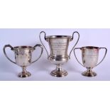 THREE VINTAGE SILVER DOG TROPHIES including the Awl Dogg trophy. 623 grams. (3)