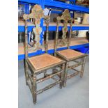 A PAIR OF 18TH/19TH CENTURY CONTINENTAL LACQUERED CHATEAU CHAIRS with high back supports. 117 cm x 4