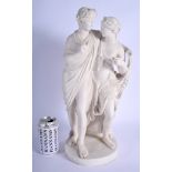 A LARGE 19TH CENTURY EUROPEAN PARIAN WARE PORCELAIN FIGURE OF LOVERS modelled upon a circular base.
