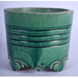 A CHINESE QING DYNASTY GREEN GLAZED POTTERY CENSER possibly earlier, decorated with a central bandin