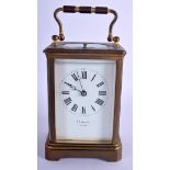 A LATE 19TH CENTURY FRENCH REPEATING BRASS CARRIAGE CLOCK retailed in Chicago. 17 cm high inc handle