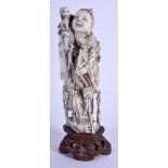 A 19TH CENTURY CHINESE CARVED BONE FIGURE OF A STANDING IMMORTAL Late Qing. Bone12 cm high.