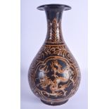 A CHINESE BROWN GLAZED POTTERY VASE 20th Century, decorated with a dragon amongst foliage. 29 cm hig