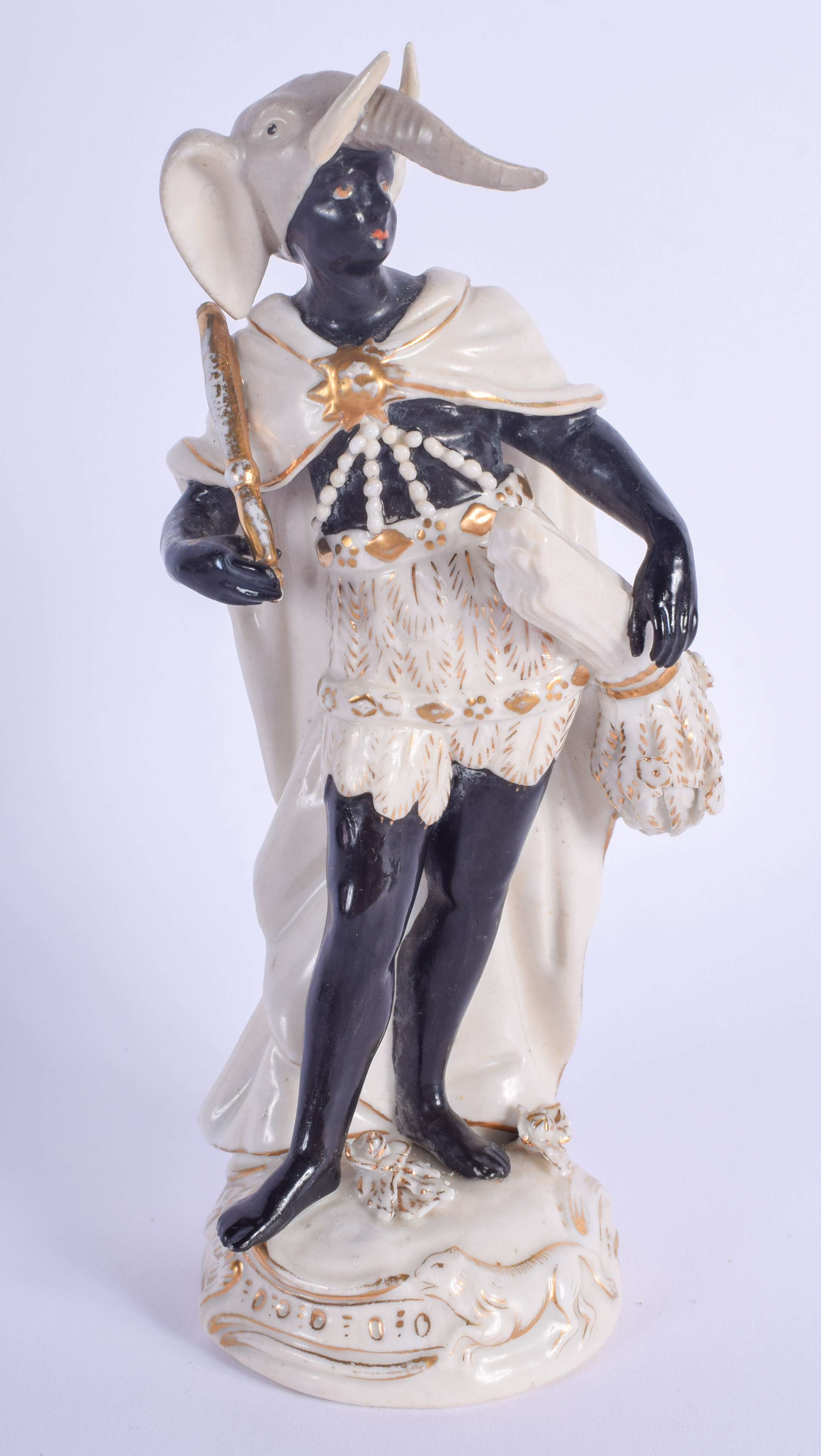 A 19TH CENTURY CONTINENTAL PORCELAIN FIGURE OF A NUBIAN MALE after an 18th century original, modelle