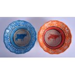 A PAIR OF ANTIQUE CONTINENTAL SPONGE WARE RURAL BOWLS painted with cows on an unusual colourway. 17