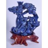 AN EARLY 20TH CENTURY CHINESE CARVED LAPIS LAZULI FIGURE Late Qing/Republic, of flowering form. Lapi