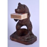 AN ANTIQUE BAVARIAN BLACK FOREST CARVED WOOD BEAR modelled as smoker compendium. 17 cm high.