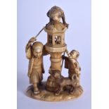A 19TH CENTURY JAPANESE MEIJI PERIOD CARVED IVORY OKIMONO modelled as two figures beside a hound & a