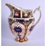 Royal Crown Derby pedestal cream jug painted with imari pattern 1128. 12 cm high