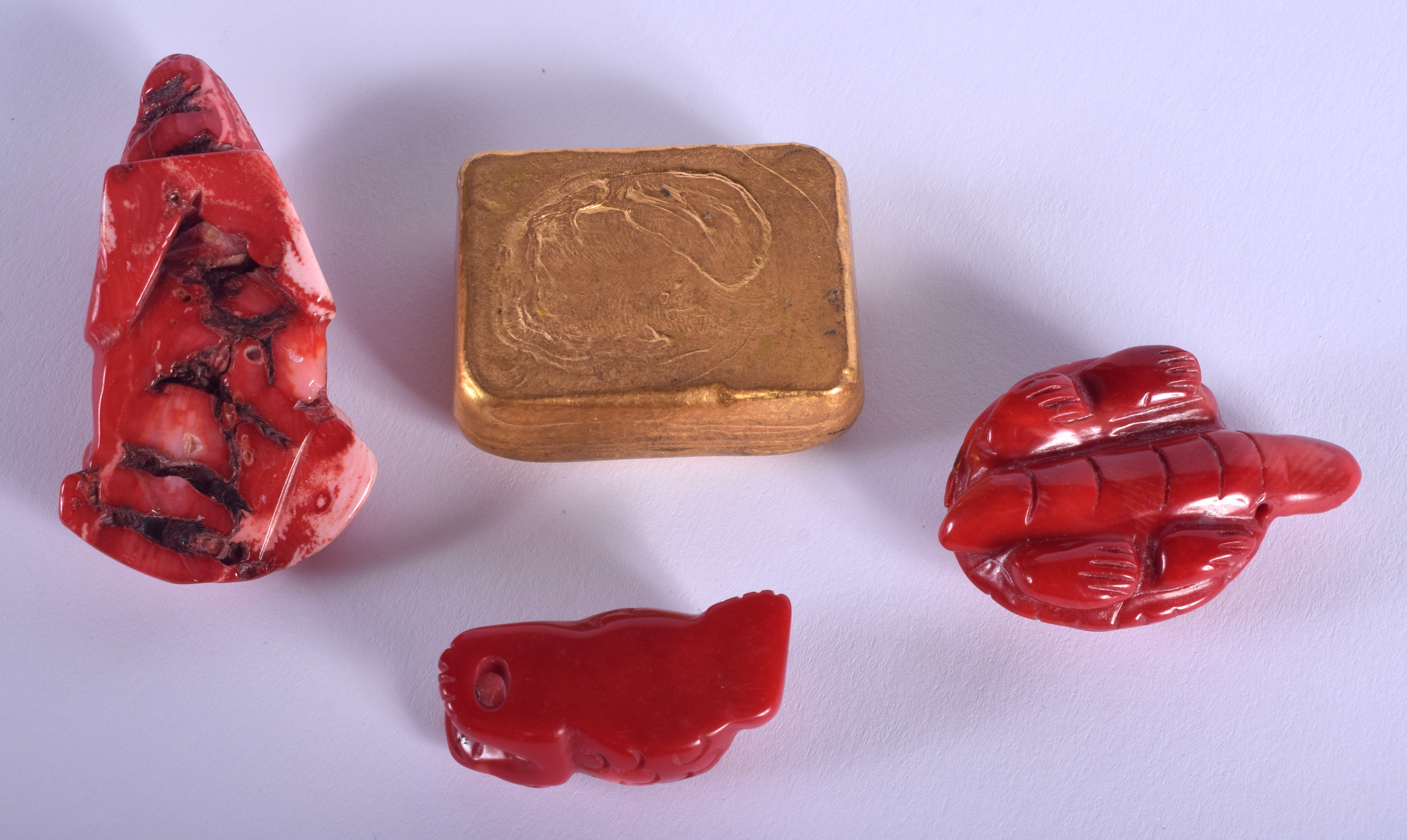 A CONTEMPORARY CHINESE YELLOW METAL INGOT together with three vintage coral figures. (4) - Image 2 of 2