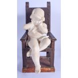 AN UNUSUAL 19TH CENTURY ITALIAN CARVED ALABASTER FIGURE OF A GIRL modelled upon a chair. 36 cm x 12