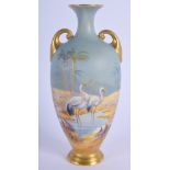 A LOVELY ROYAL WORCESTER TWIN HANDLED BLUE VASE by Charlie Johnson. 17 cm high.