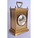 A BOXED JUNGHANS BRASS MANTEL CLOCK decorated with foliage. 20 cm x 14 cm.