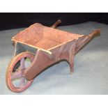 A VINTAGE FRENCH RED PAINTED MINIATURE CHILDS WHEEL BARROW. 27 cm x 75 cm.