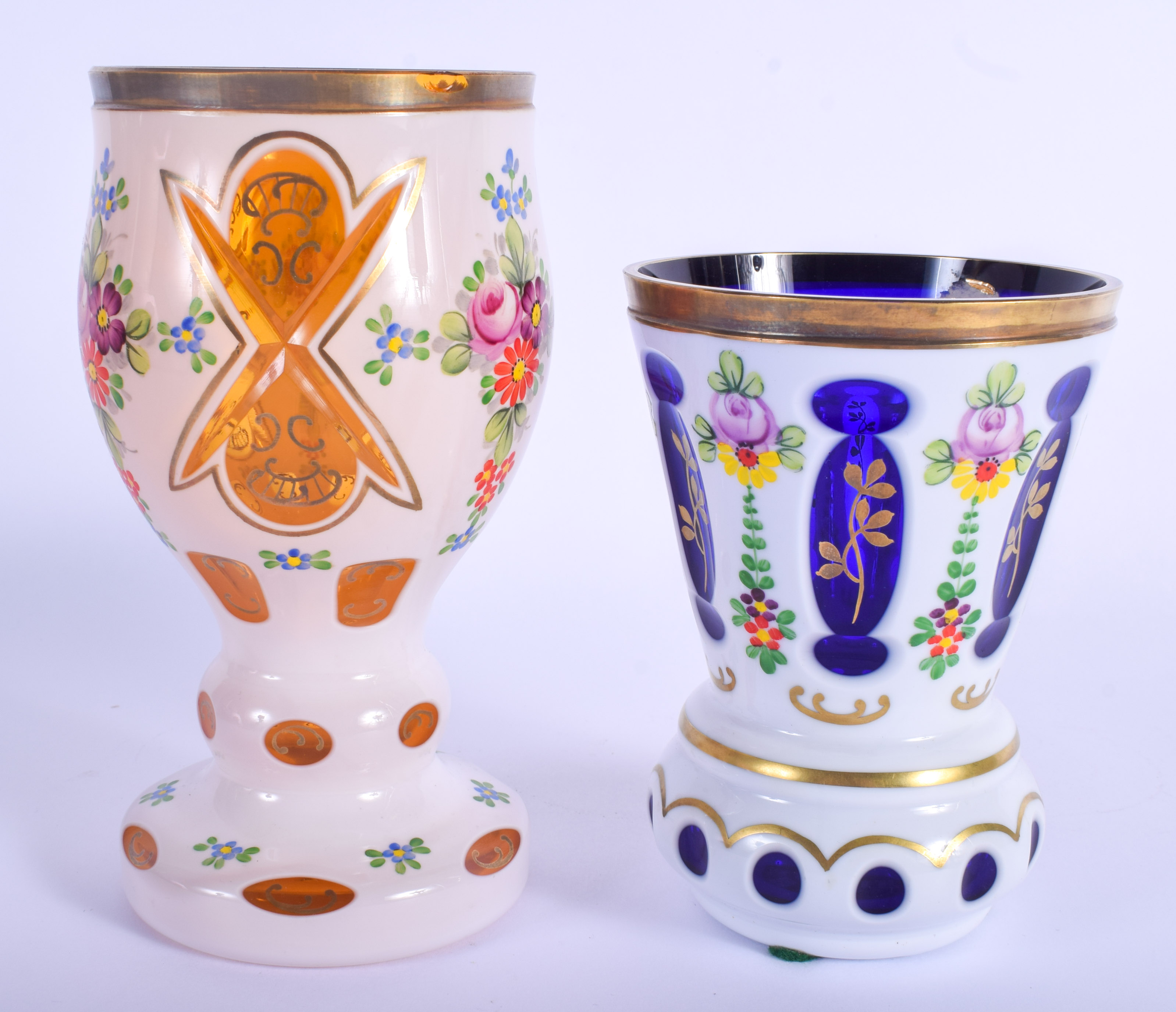 TWO BOHEMIAN ENAMELLED GOBLETS decorated with flowers. Largest 17 cm high. (2)